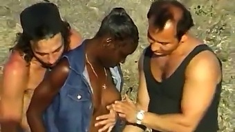 Two White Men Pleasure A Black Woman On The Seaside In An Amateur Interracial Encounter